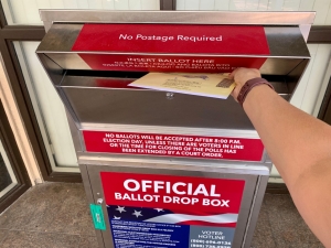 Dropping off ballot at drop box